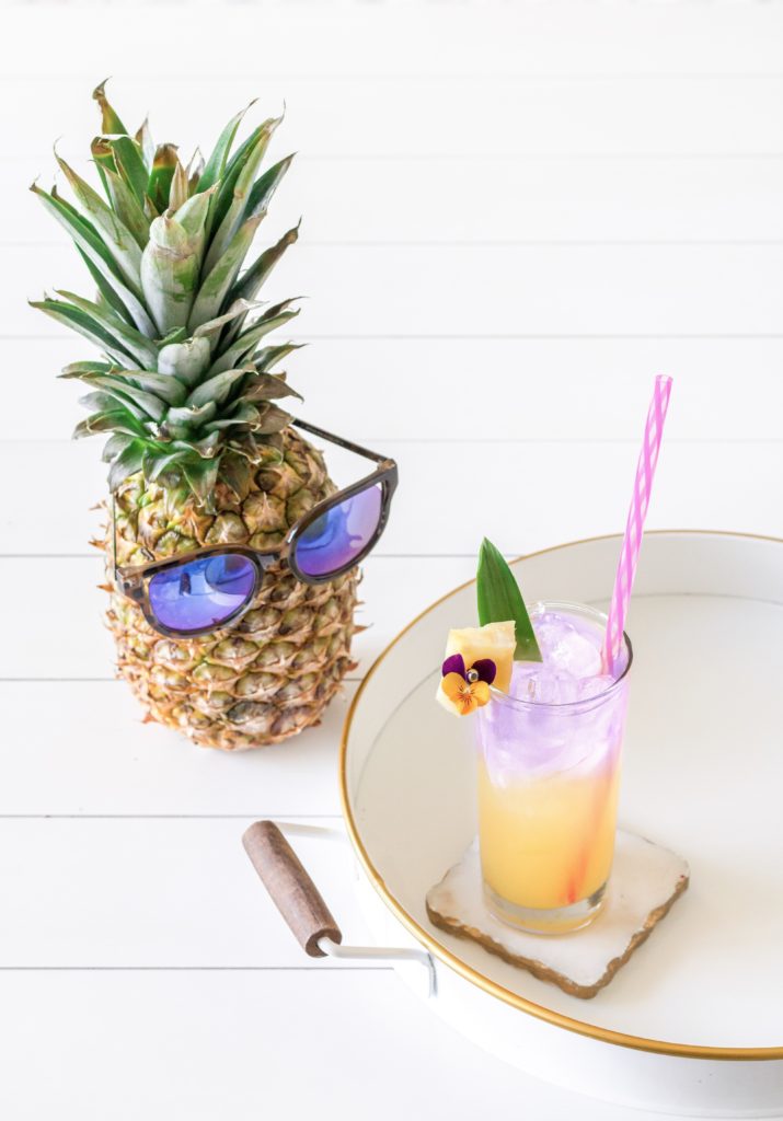 Super cool layered purple gin cocktail with pineapple 