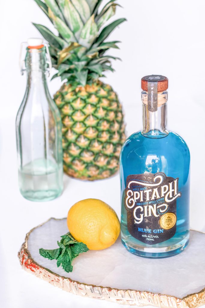 Closeup of Epitaph Gin, a blue gin produced in Alberta, Canada