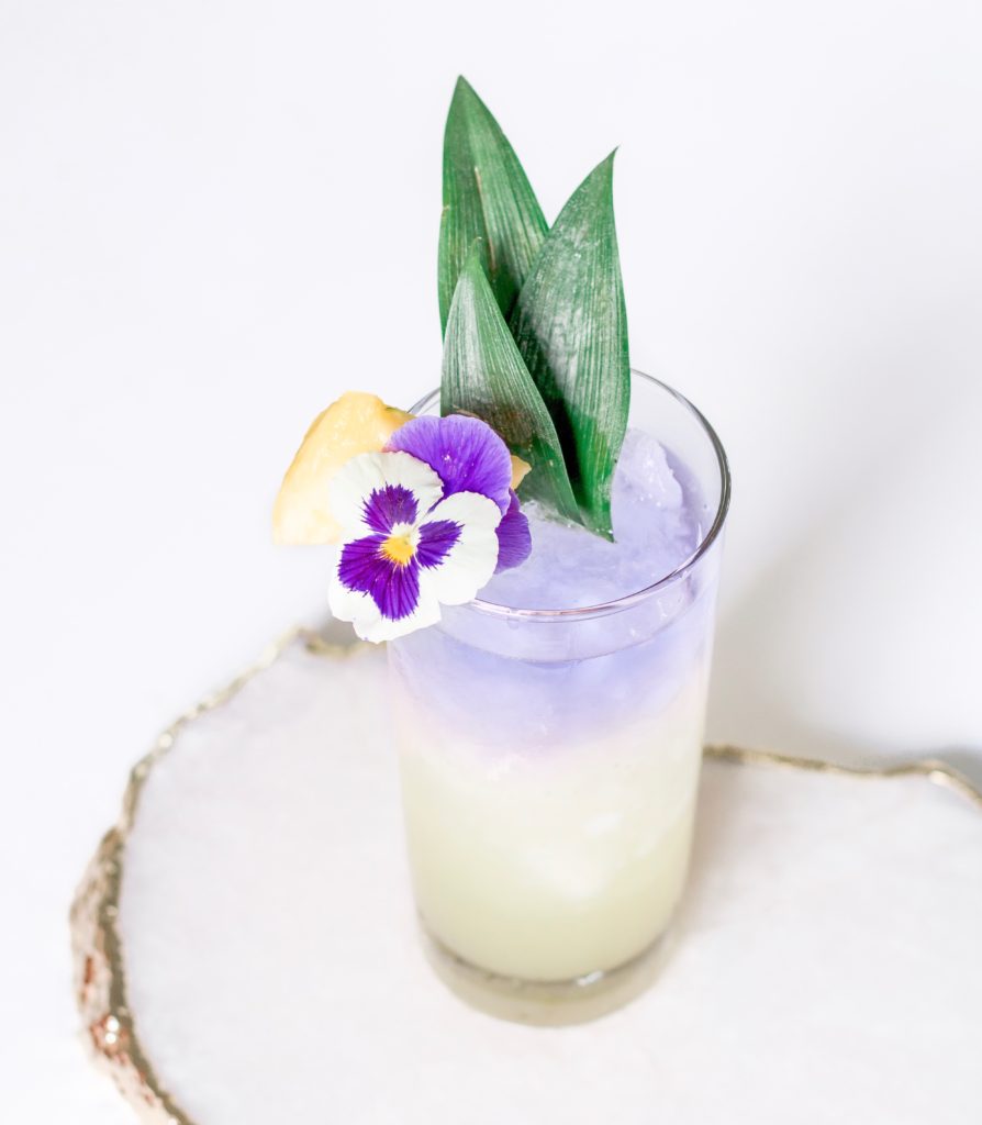 Beautiful color changing cocktail: blue gin turns violet