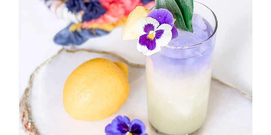 Color changing layered pineapple gin cocktail