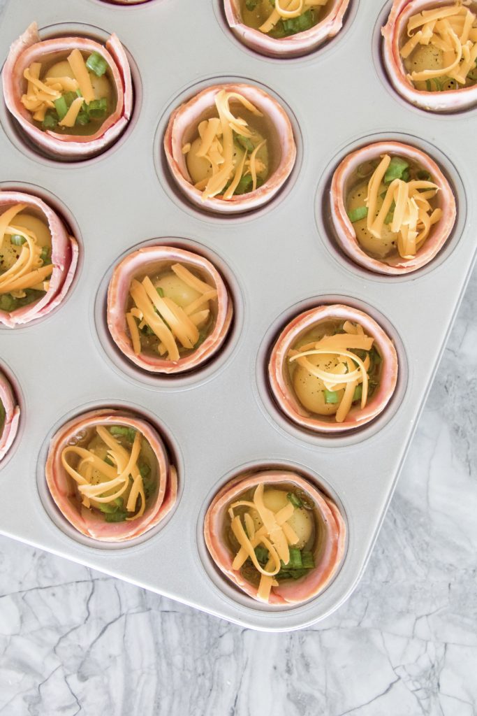 Egg cups with cheddar cheese, onion and bacon style turkey slices