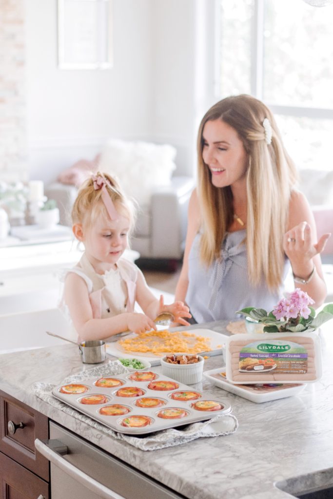 Blogger Holly Hunka making Lilydale make-ahead breakfast ideas with her daughter