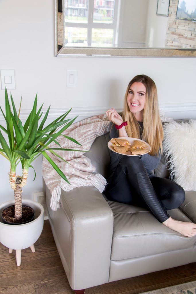 Chandeliers and Champagne blogger Holly Hunka enjoying Lilydale make-ahead breakfast quesadilla 