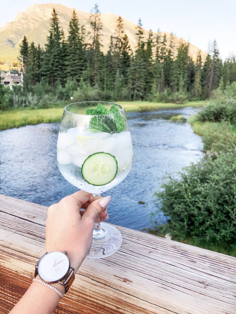 Hendrick's Elderflower Gin and Tonic enjoyed mountainside by river in Canmore, Alberta 