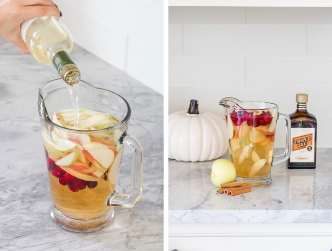 Pouring apple cider sangria into a pitcher