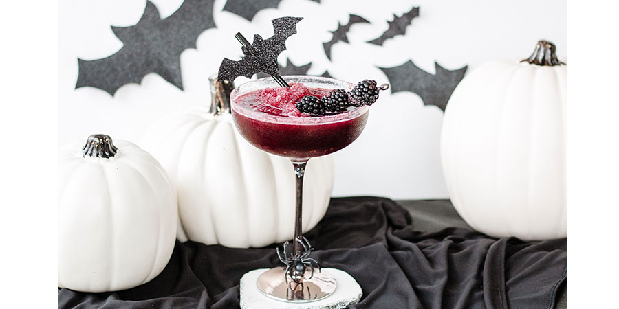 Wicked Blackberry Margarita with spooky haunted bats