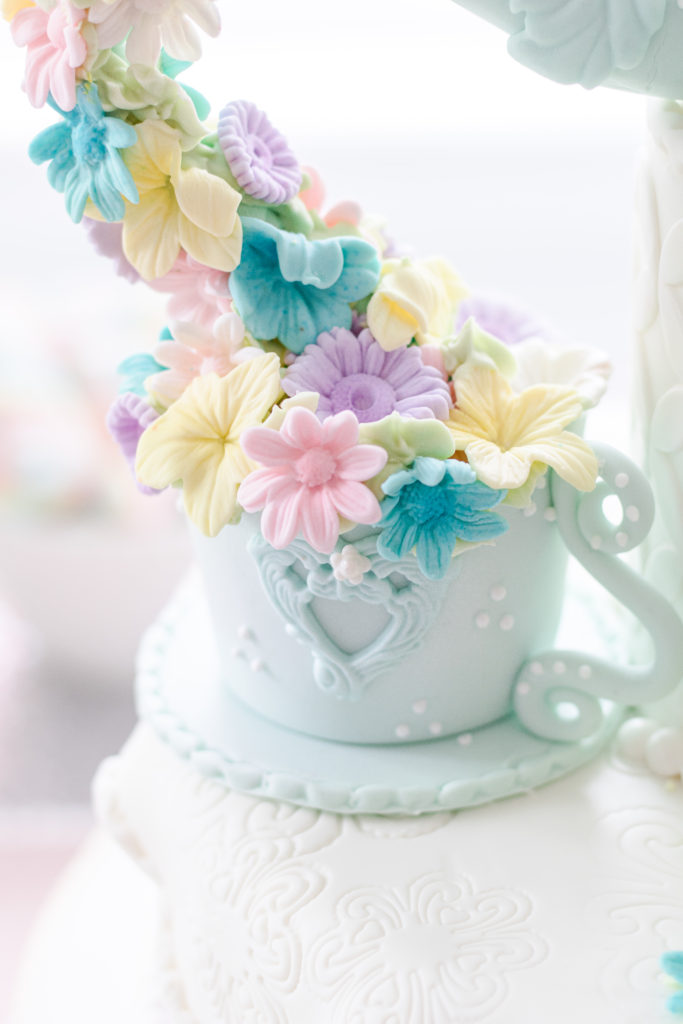 Closeup of cake tea cup with flowers