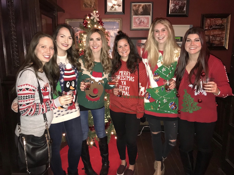 Holly Hunka of Chandeliers and Champagne and friends wearing ugly Christmas sweaters