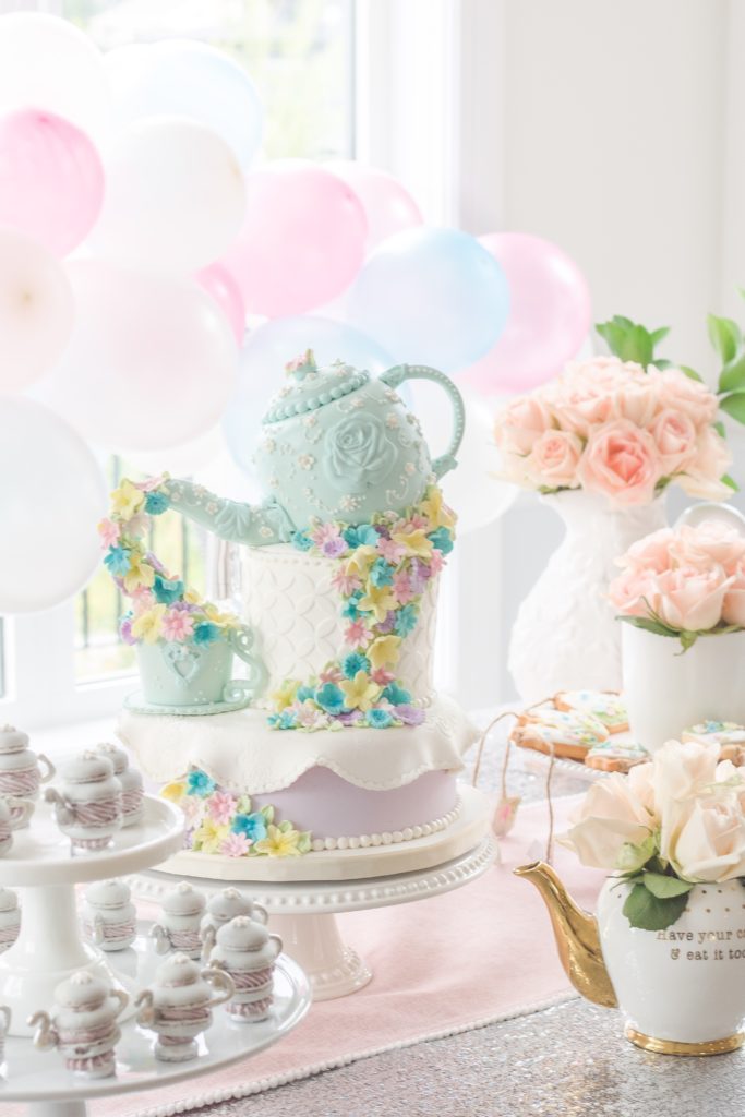 Birthday tea party cake on white cake stands