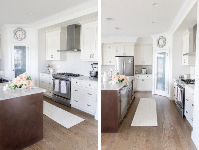 White and brown wood kitchen with rug runner and pink roses