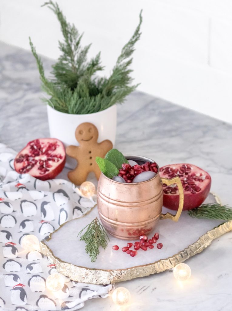 Yule Mule: Christmas Pomegranate Moscow Mule with gingerbread cookie