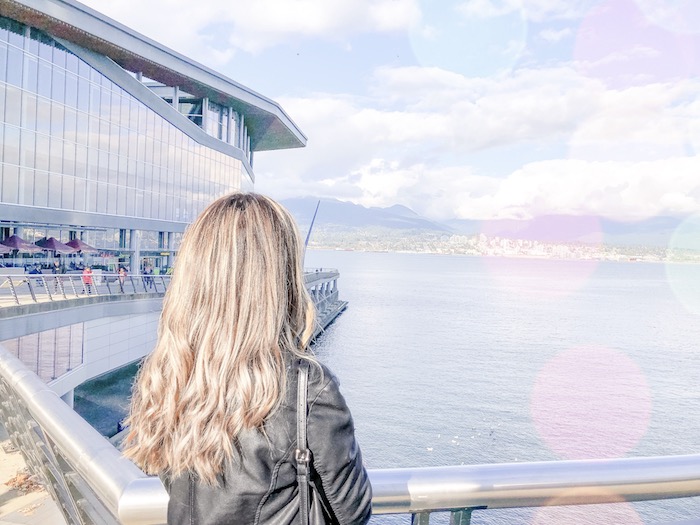 Blogger Holly Hunka looking at Vancouver harbour