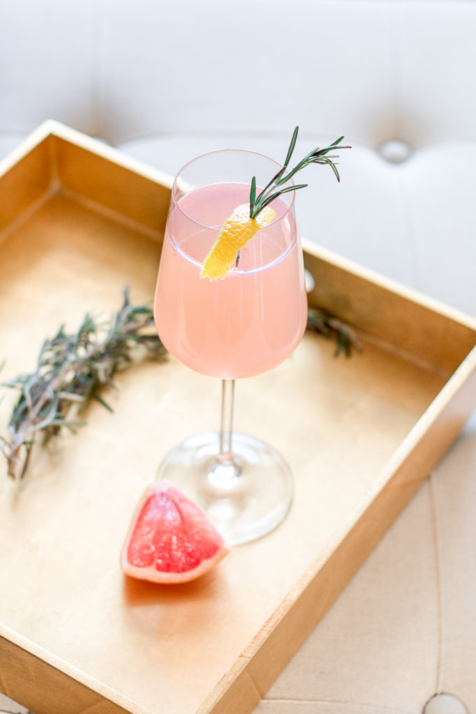 Cute AF Pink Valentine’s Day Cocktails : Delicious Redheaded French Blonde cocktail with rosemary, lemon and fresh grapefruit