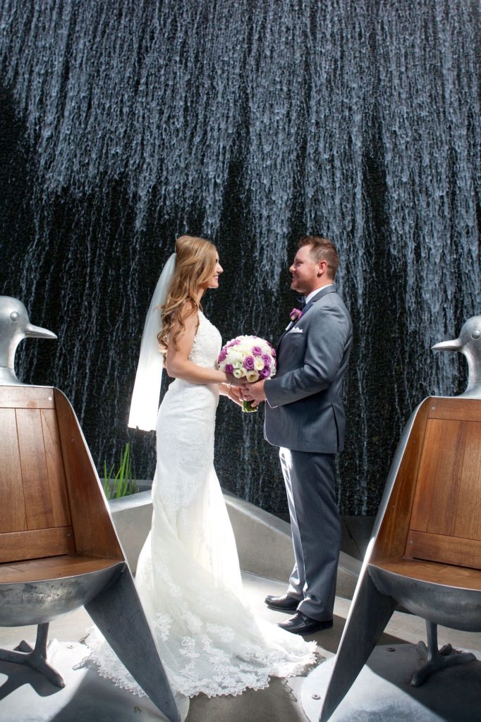 Las Vegas bride and groom in front of waterfall