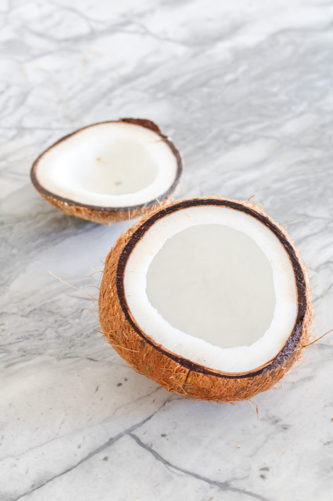 Coconut on white granite background