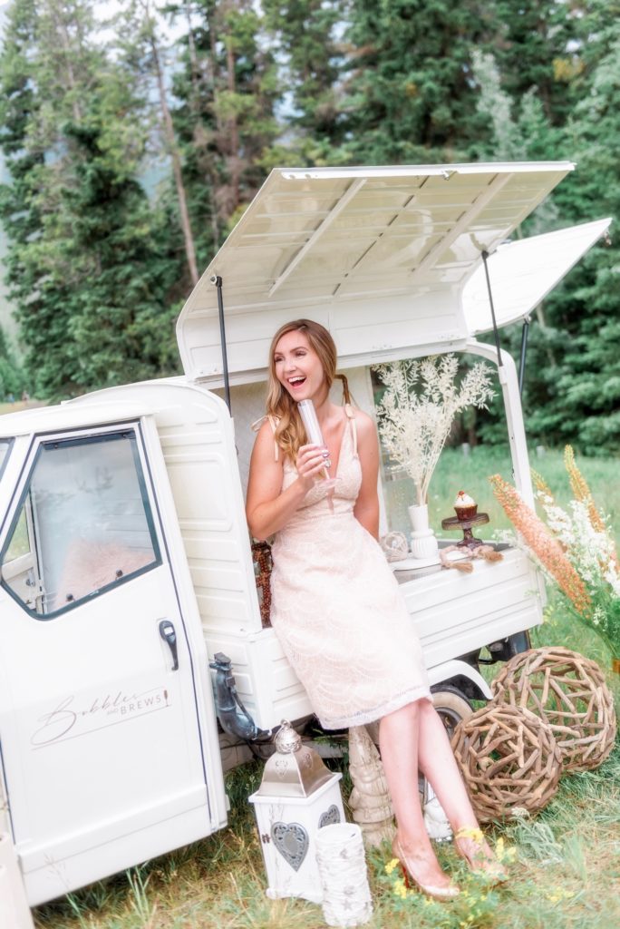 Blogger Holly Hunka with mobile champagne truck