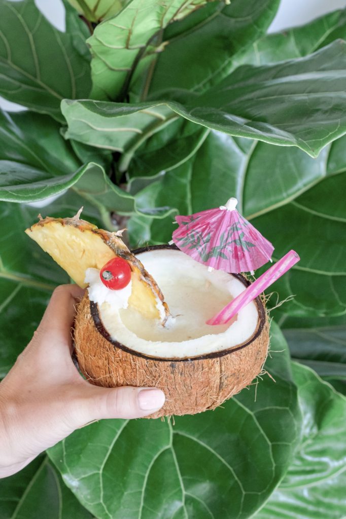 Classic Piña Colada cocktail in a coconut cup