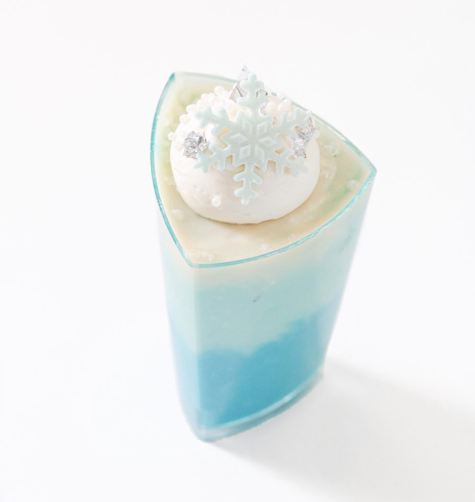 Blue ombre cheesecake shots with milk chocolate snowflake