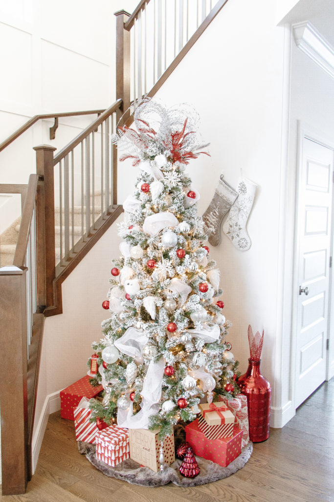 Full look at flocked red and white Christmas tree