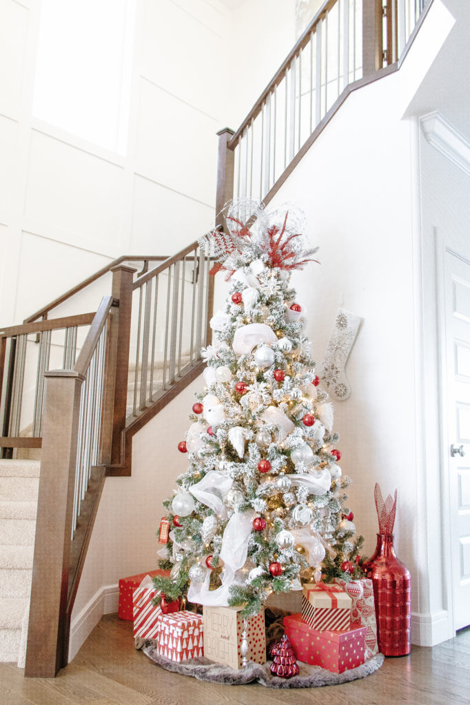 Full look at red and white flocked Christmas tree