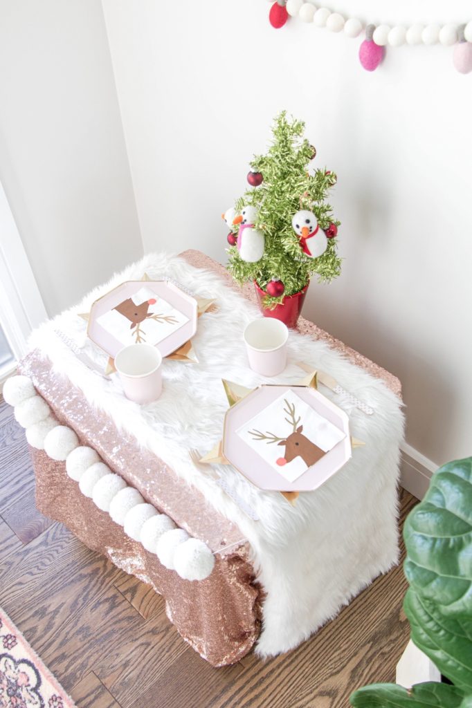 Overhead shot of Kids Christmas table with mini tabletop tree
