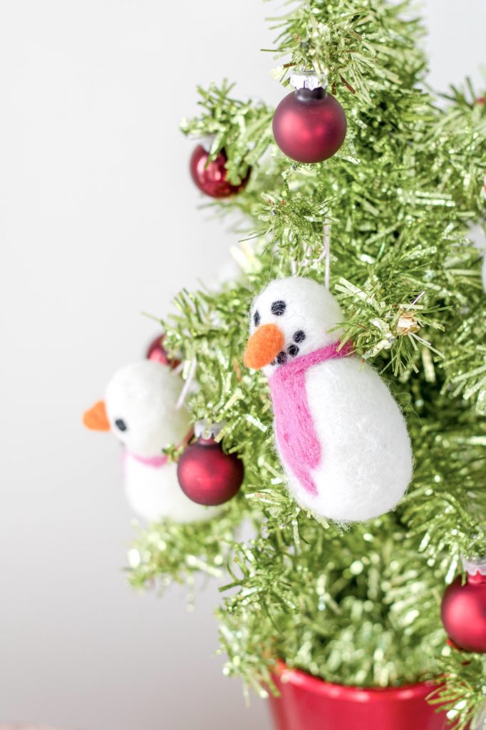 Vibrant tabletop Christmas tree decor with felt snowman ornaments: Kids' Christmas party table