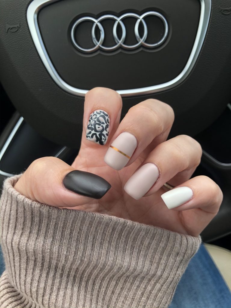 Closeup of matte leopard print nails