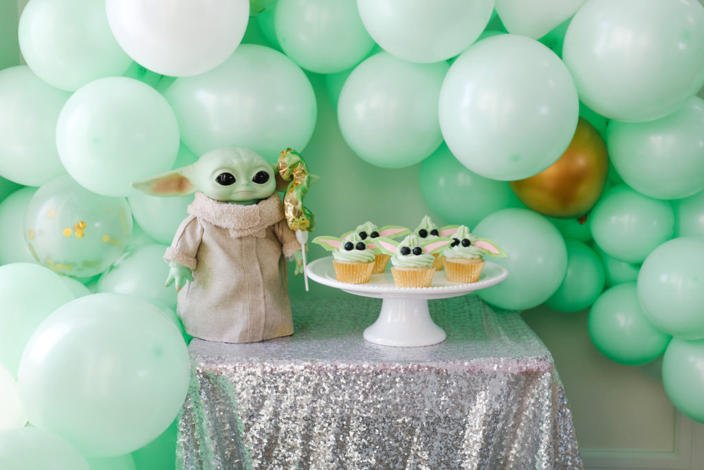 Baby Yoda Birthday Party Dessert table with Grogu cupcakes and balloons