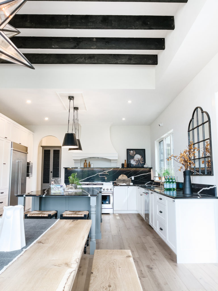 Black and white kitchen with wooden beams - Edmonton Dream Home - 2022 Covenant Foundation Lottery Dream Home
