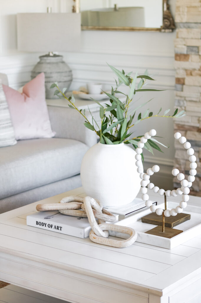 Closeup of Sofa Land tabletop decor - white, neutral organic coffee table decor