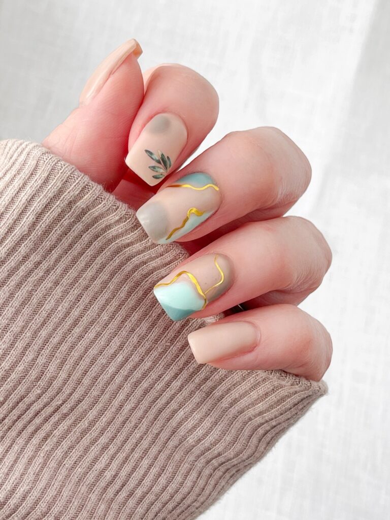 Gold abstract matte nails 