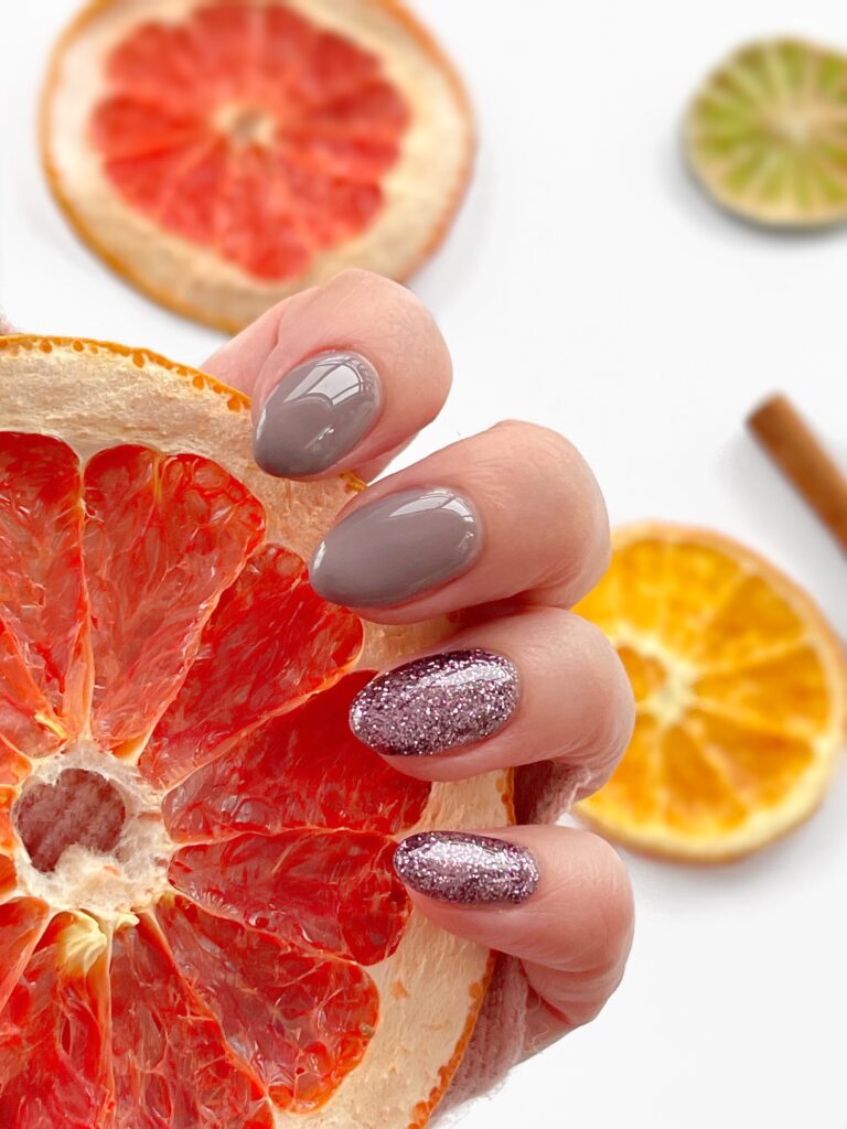 Purple sparkle nails with grapefruit