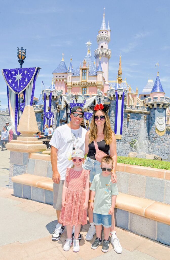 Disneyland Tips - Family Photo outside iconic Disneyland castle